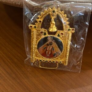 Shri Krishna Bihari Ji picture in gold decorative free standing frame.